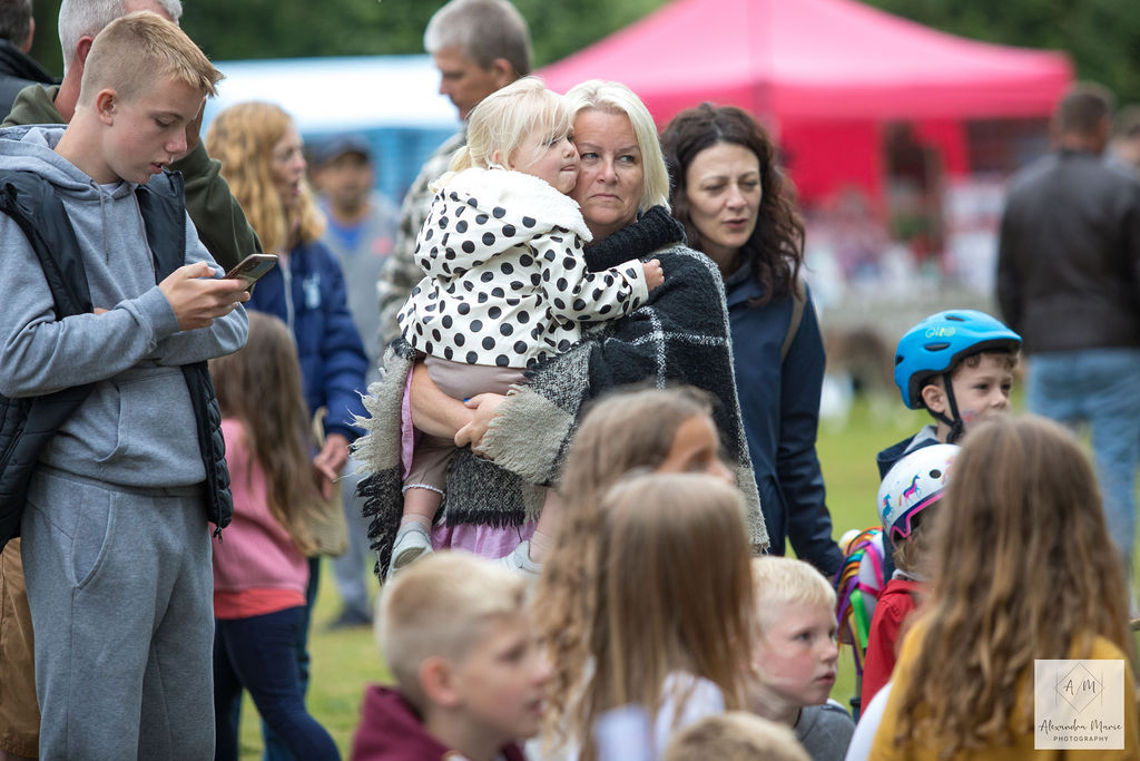 Children and parents enjoying Punch and Judy